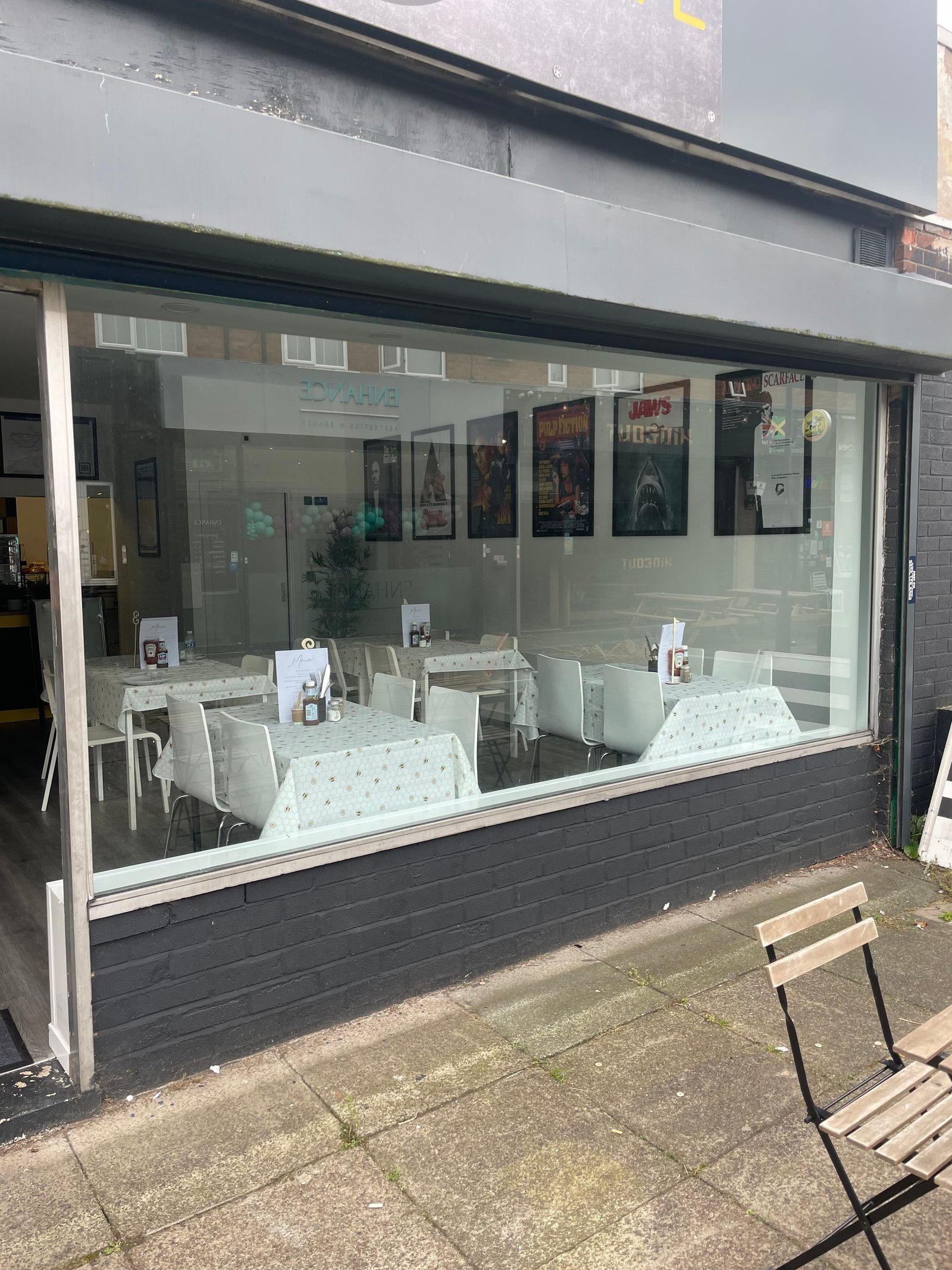 Beestro Café before window frosting — full clear glass frontage with no privacy, Urmston