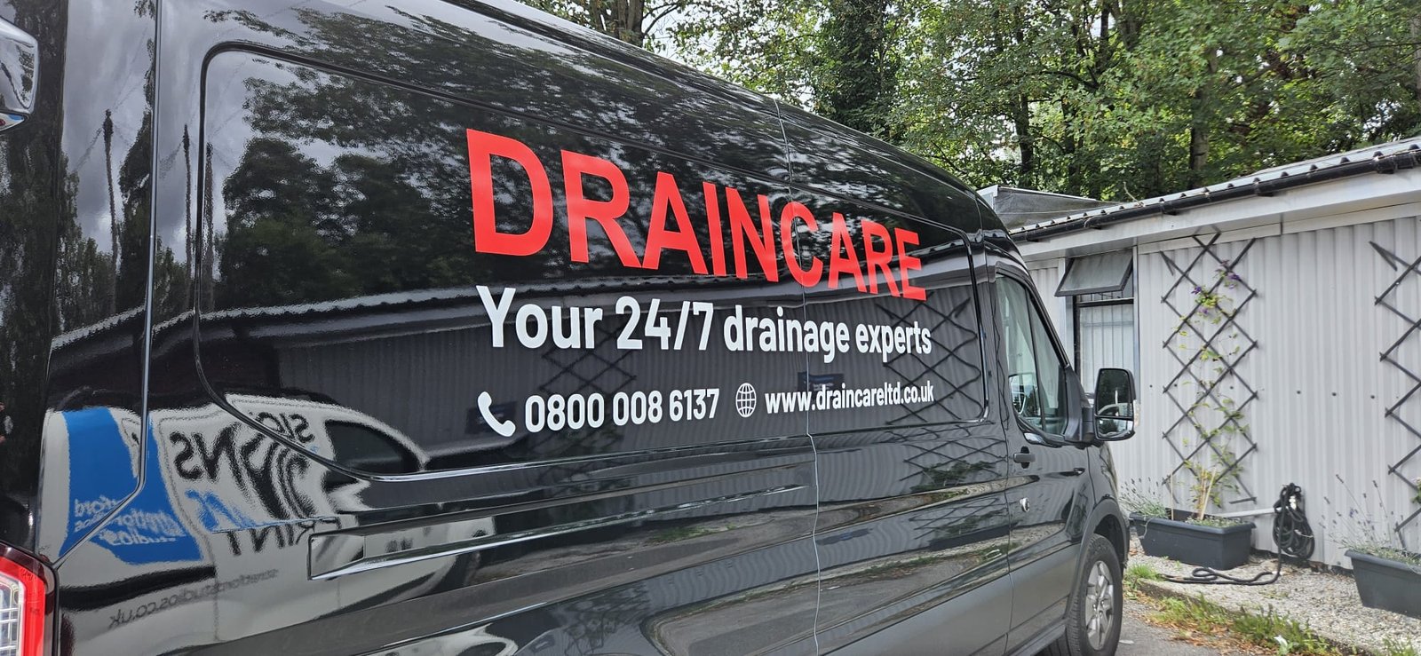 Draincare fleet livery — branded van side panel produced and applied by Digi Print, Manchester