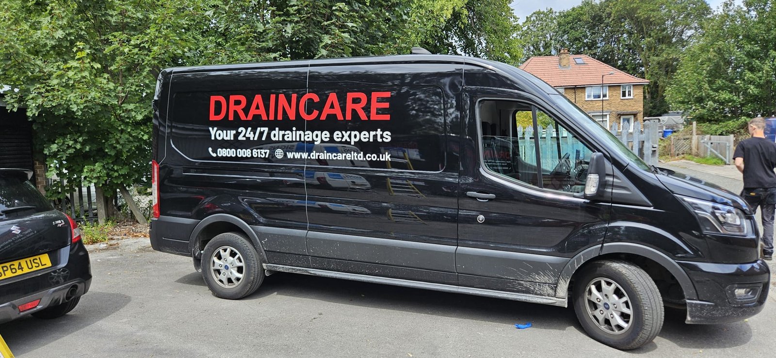 Draincare branded van — full side profile showing fleet livery