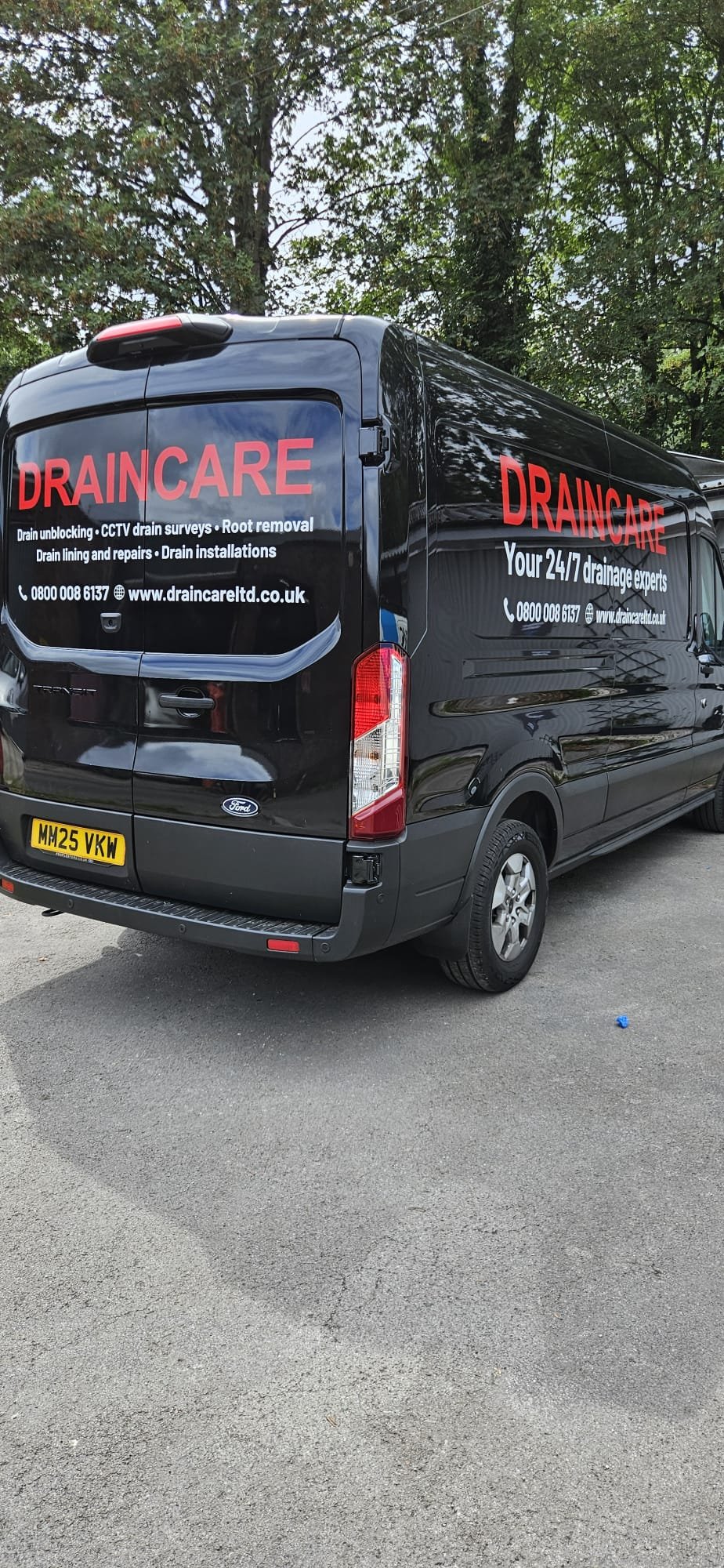 Draincare van fleet — rear and side view of completed vehicle graphics