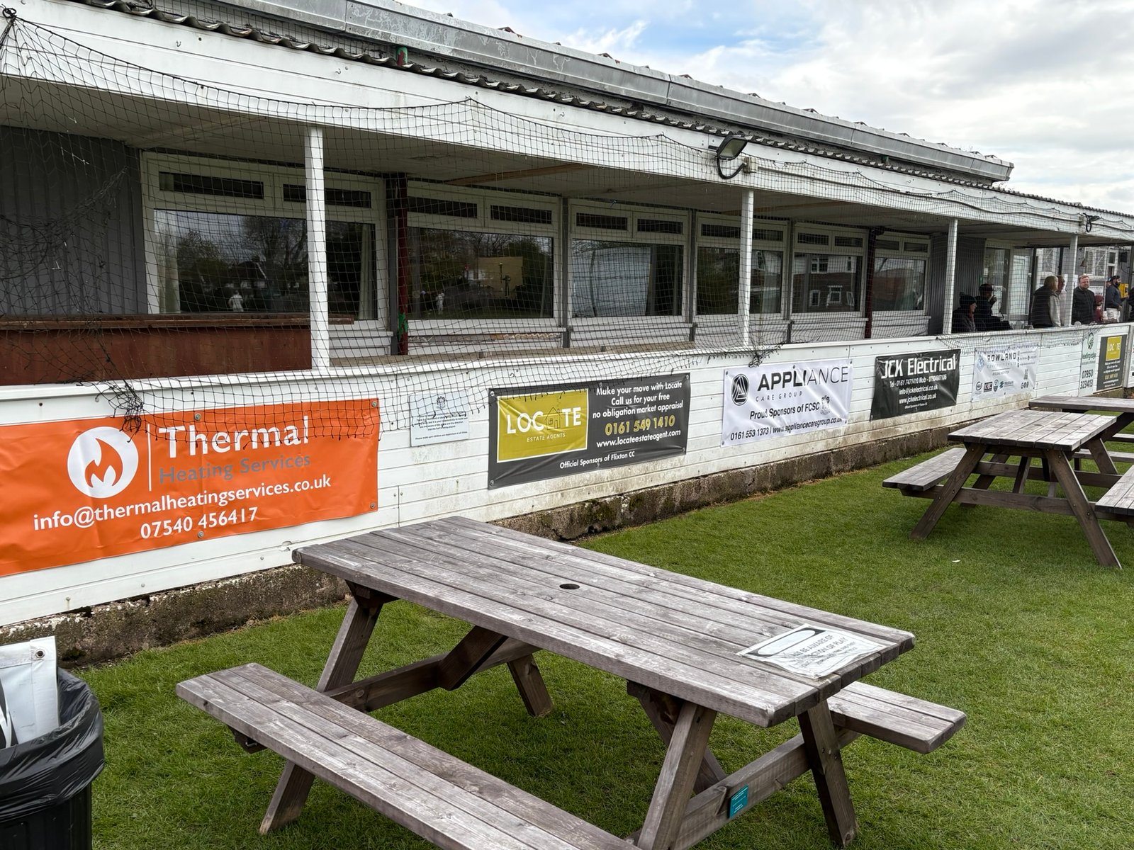 Flixton Cricket Club sponsor banners — printed PVC banners installed around the ground perimeter