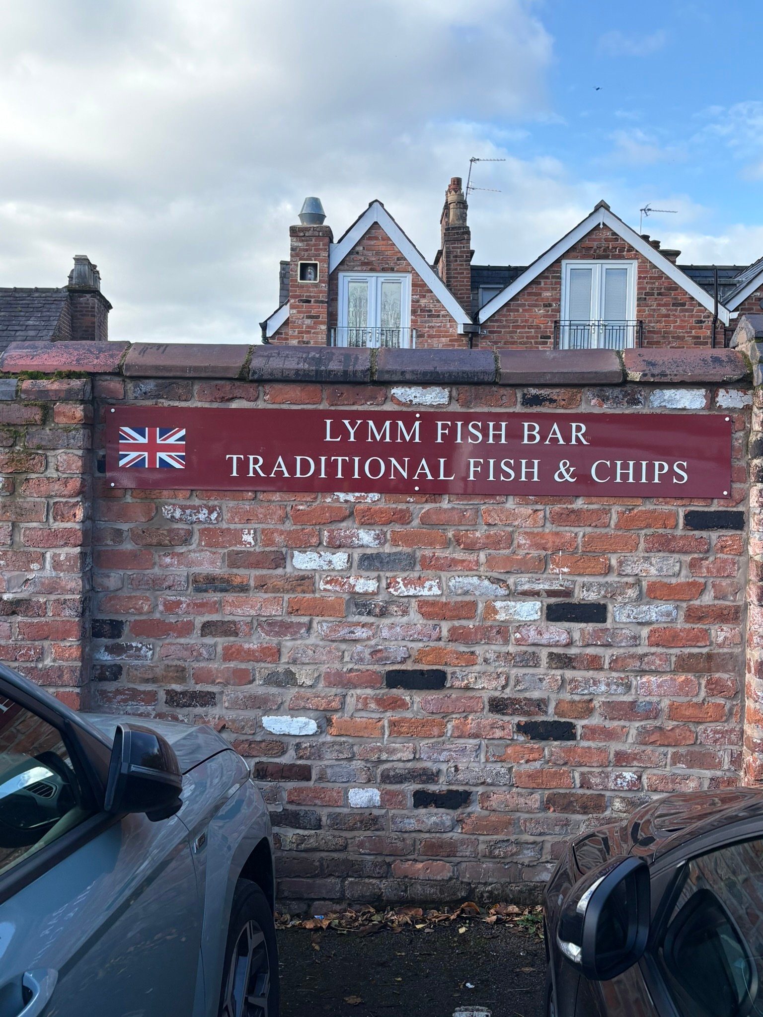 Lymm Fish Bar fascia sign — Traditional Fish and Chips lettering on shopfront